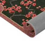Imperial arch bloom rug rolled at corner showing coral blossoms, pink border and grey backing