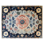 An exquisite hand-tufted area rug featuring a vintage floral design with a central blossom medley in soft pastels and deep navy accents. Ideal for adding a touch of elegance to living rooms or offices.