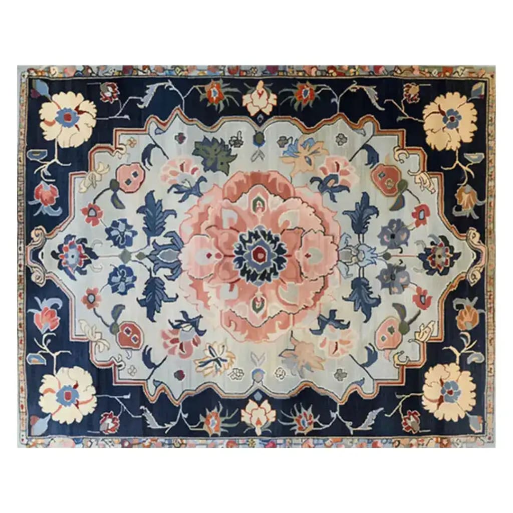 An exquisite hand-tufted area rug featuring a vintage floral design with a central blossom medley in soft pastels and deep navy accents. Ideal for adding a touch of elegance to living rooms or offices.