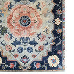 This vibrant area rug features an intricate floral design with a medley of blue, pink, and cream tones, perfect for adding a touch of vintage elegance to your living room or office. Hand-tufted from premium wool, this floral rug combines traditional artistry with modern style, making it an ideal choice for those seeking unique area rugs for living room spaces.