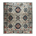 An elegant and vintage-inspired square area rug with intricate floral patterns in navy, red, and gray tones. This wool rug is perfect for a formal dining room or office setting, reminiscent of classic Persian rugs. The hand-tufted design adds a touch of sophistication to any space, making it an ideal choice for those seeking a stylish and timeless piece.