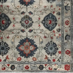 Imperial Elegance Hand Tufted Rug featuring a detailed floral design. This square area rug showcases intricate vintage patterns in rich, warm colors, ideal for a dining room or office. Its wool construction offers a luxurious feel, perfect for formal dining room settings or as a statement piece in an office. This Persian-inspired floral rug adds a touch of timeless elegance to any space.
