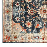 Close-up view of the Imperial Garden Hand Tufted Wool Rug showcasing intricate floral patterns in vibrant colors. This area rug is perfect for adding elegance to large living room spaces, embodying the charm of quality wool rugs.