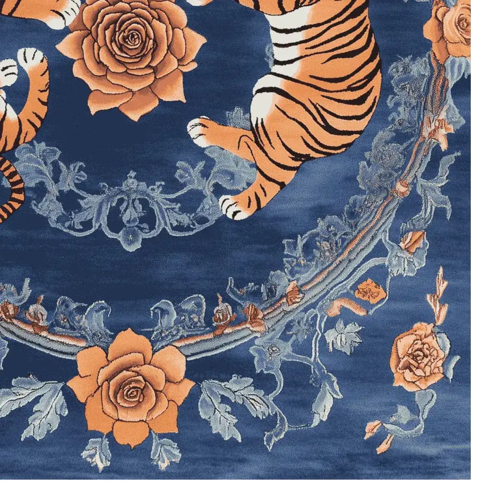 This beautiful area rug features a vibrant design with orange tigers and floral patterns against a deep blue background. Perfect for adding a vintage touch to your living room, this hand-tufted wool rug combines elegance with durability.