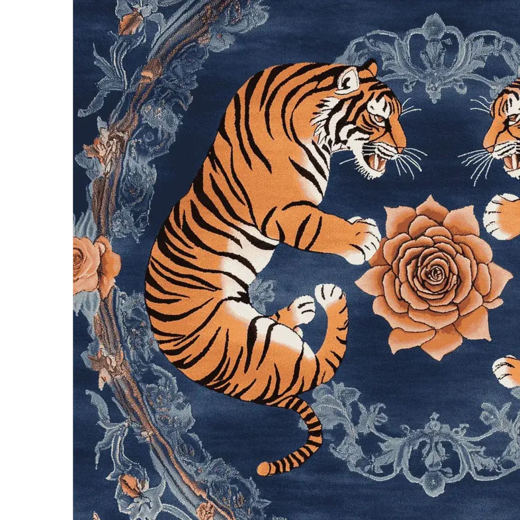 A vibrant area rug featuring a striking design of two tigers surrounded by intricate floral patterns. This wool rug showcases a rich blue background with orange and black tiger motifs, complemented by detailed rose and vine accents. Perfect for adding a vintage touch to your living room decor, this floral rug combines elegance with a bold statement.