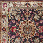 Close-up view of the Imperial Jewel Hand Knotted Area Rug, showcasing an intricate floral design with vibrant colors, perfect for adding a vintage touch to dining or living rooms. This square area rug made from high-quality wool features a Persian-inspired pattern, ideal for those seeking elegant dining room carpets or living room area rugs.
