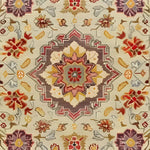 A detailed view of the Imperial Opulence Hand Knotted Area Rug showcasing its intricate floral and geometric patterns in warm tones. Perfect for large living room spaces, this 8x10 vintage rug combines Persian influences with a modern touch, making it an elegant centerpiece for any home decor.
