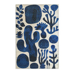 Indigo Desert Dreams rug portrait flat shot indigo abstract botanical cactus spirals leaf shapes on cream background