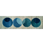 The Indigo Orbit Hand Tufted Wool Rug Runner features a contemporary design with overlapping blue circles on a neutral background. Perfect as a hallway runner rug or kitchen runner, this area rug adds a modern touch to any living room or bathroom.