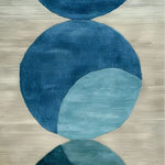 Indigo Orbit Hand Tufted Wool Rug Runner featuring abstract blue circles on a beige background. Perfect as an area rug, this contemporary wool design enhances any kitchen, hallway, or living room with a modern touch.