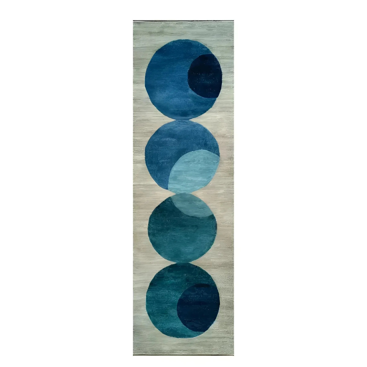 The Indigo Orbit Hand Tufted Wool Rug Runner features a contemporary design with overlapping blue circles against a neutral background. This area rug is perfect for adding a modern touch to your living room, hallway, or kitchen. Made from high-quality wool, it serves as an elegant hallway runner rug, suitable for both large living rooms and cozy spaces.