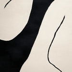 Close-up view of the Ink Flow Hand Tufted Rug showcasing its contemporary design in black and white. This wool area rug is perfect for adding a modern touch to living room spaces, especially suited for living room rugs sized 8x10.