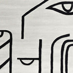 Contemporary wool area rug featuring abstract black line art on a neutral background, ideal for large living rooms. This 8x10 hand-tufted rug adds a modern touch to any space.