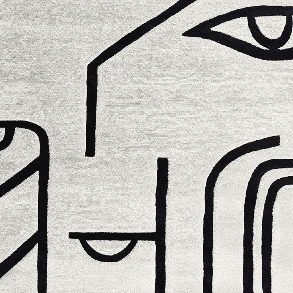 Contemporary wool area rug featuring abstract black line art on a neutral background, ideal for large living rooms. This 8x10 hand-tufted rug adds a modern touch to any space.