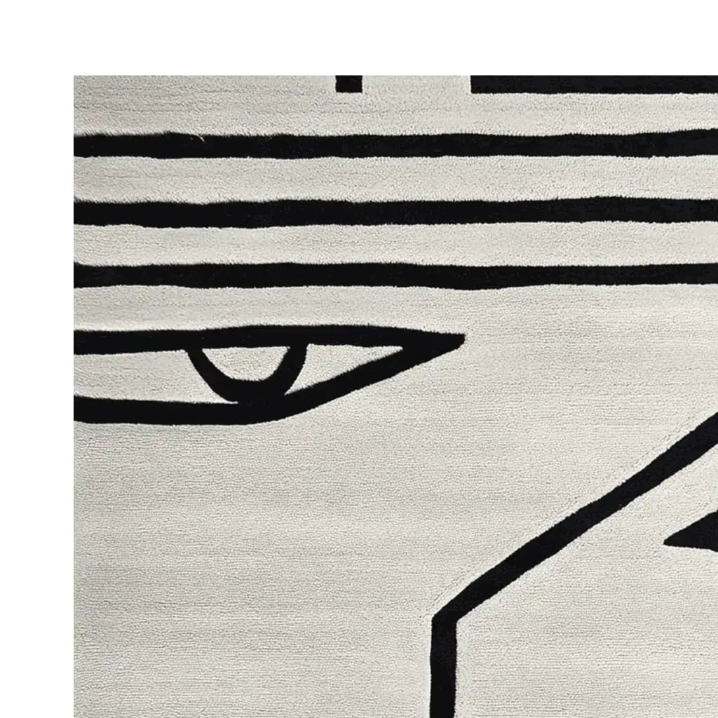 Close-up of the Inkbound Face Geometry Hand Tufted Rug, showcasing its bold black abstract lines on a soft cream background. This contemporary area rug is made of high-quality wool, perfect for large living rooms. Ideal for those seeking an artistic touch in an 8x10 wool rug.