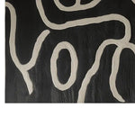 Close-up view of the Inkstream Hand Tufted Wool Rug showcasing an abstract pattern in black and white. Perfect for adding a contemporary touch to living room area rugs, this wool rug brings modern elegance to any space. Ideal for living room rugs 8x10, the design highlights intricate tufting details.