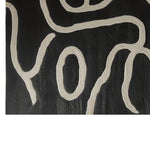 Close-up view of the Inkstream Hand Tufted Wool Rug showcasing an abstract pattern in black and white. Perfect for adding a contemporary touch to living room area rugs, this wool rug brings modern elegance to any space. Ideal for living room rugs 8x10, the design highlights intricate tufting details.