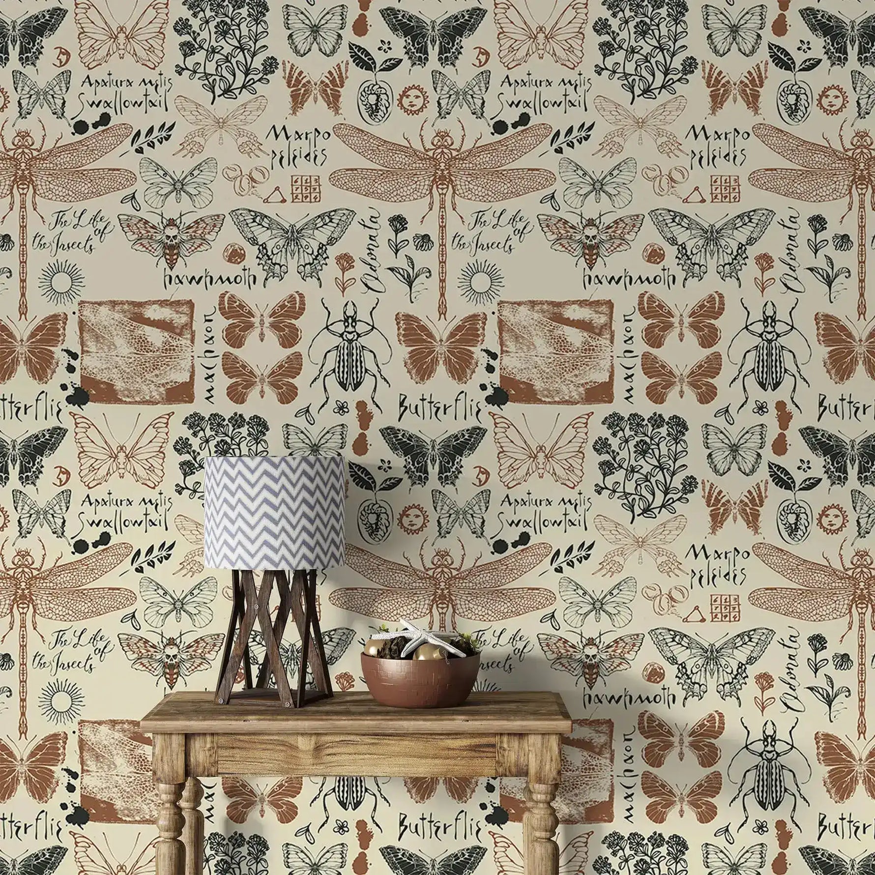 Vintage insect garden wallpaper detailing butterflies and dragonflies with script labels behind a rustic console table