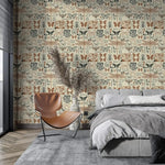 Insect garden wallpaper with butterflies and dragonflies on cream in a modern bedroom with grey bedding