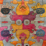 Vibrant interlocking tapestry hand-knotted area rug featuring a contemporary abstract design with bold colors, perfect for adding a modern touch to living room spaces. This artistic rug showcases intricate patterns in shades of orange, pink, and blue.