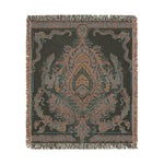 Intricate Floral and Serpentine Woven Blanket full view in dark charcoal colorway with amber and pink central medallion and fringe edge