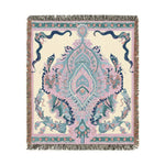 Corner of Intricate Floral and Serpentine blanket rolled back showing orange poppy and blue foliage on dark navy, grey backing