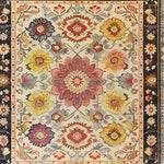 Intricate tapestry hand tufted area rug featuring a vibrant floral design. The vintage-inspired wool rug showcases colorful blooms in shades of red, yellow, and purple, perfect for enhancing living room decor. A beautiful choice for those seeking elegant rugs for living rooms.