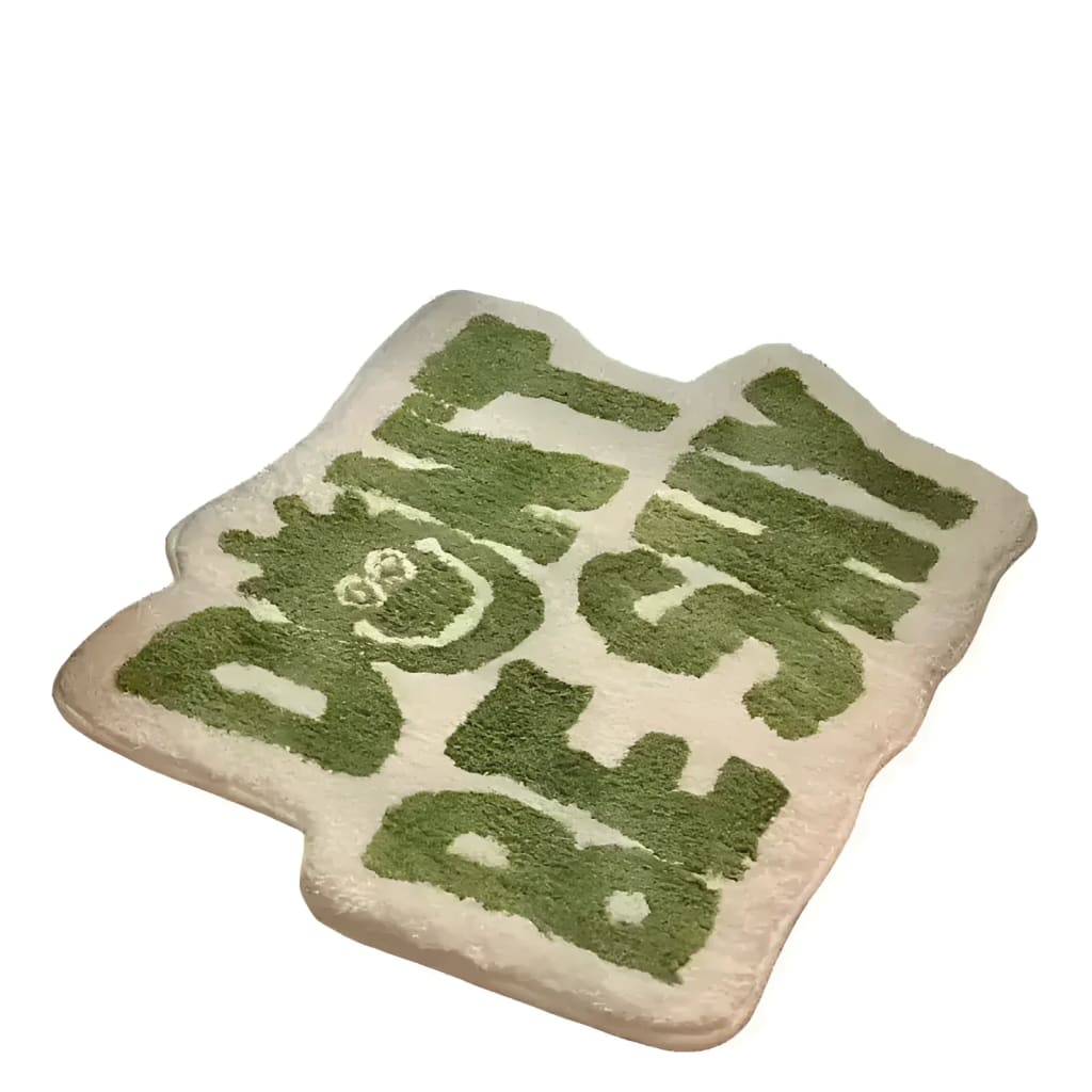 Irregular 'Don't Be Shy' area rug with bold green lettering on a cream background, perfect for adding a playful touch to living room area rugs. This unique design stands out as an ideal piece for area rugs for living room decor.