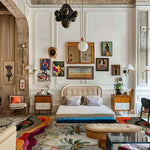 A stylish formal dining room featuring the Island Escape Tapestry Hand Tufted Rug. This wool square area rug adds a vibrant touch with its abstract design, perfectly complementing the modern decor and art-filled walls. Ideal for dining rooms or offices, this square rug is a stunning focal point.