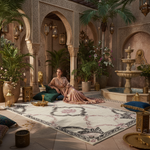 Woman in a luxurious interior setting with arches, plants, and a fountain.