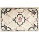 Ivory Bloom Border Hand Tufted Rug, a luxurious wool area rug perfect for a large living room. This vintage rug features an intricate floral design in soft pink and black tones, adding a touch of elegance to any space. Ideal for those seeking large area rugs to complement their living room decor.