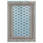 The Javarak Blue Hand Knotted Area Rug showcases an intricate design with a soft blue background and elegant geometric patterns, perfect for elevating your living space. This exquisite area rug is ideal for those seeking large living room rugs that combine style and comfort.
