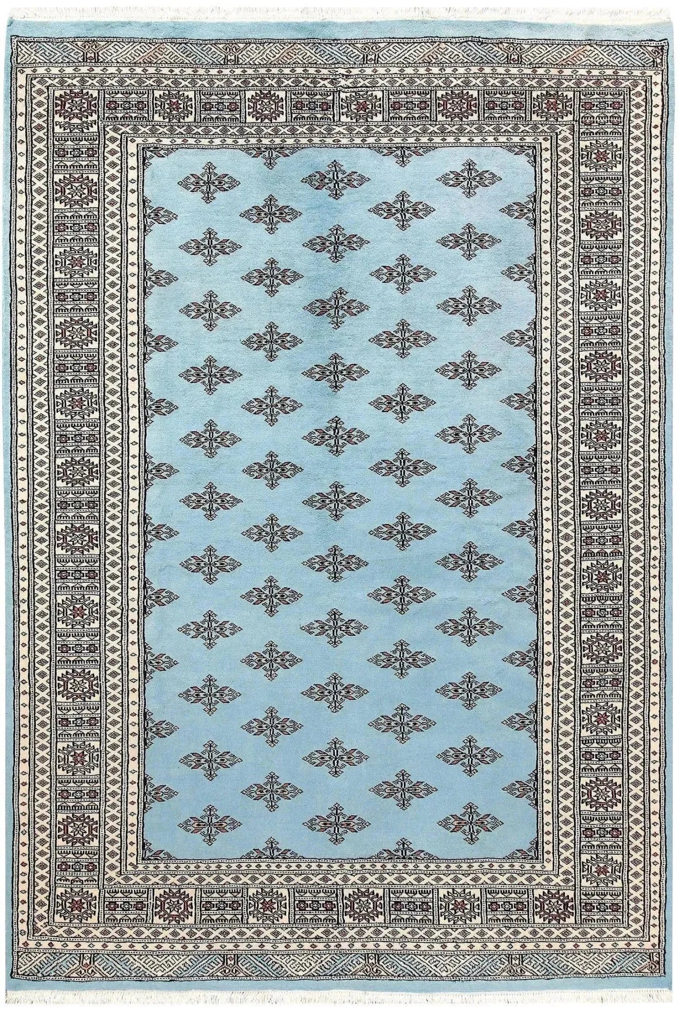 The Javarak Blue Hand Knotted Area Rug showcases an intricate design with a soft blue background and elegant geometric patterns, perfect for elevating your living space. This exquisite area rug is ideal for those seeking large living room rugs that combine style and comfort.