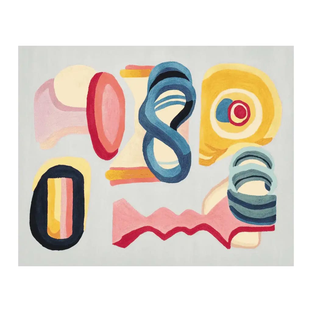 Joy Shape Parade Hand Tufted Area Rug featuring a vibrant abstract design in bold colors, perfect for adding a contemporary touch to your living room. This wool rug showcases a playful mix of shapes in shades of blue, yellow, pink, and red, ideal for modern rugs for living room decor.