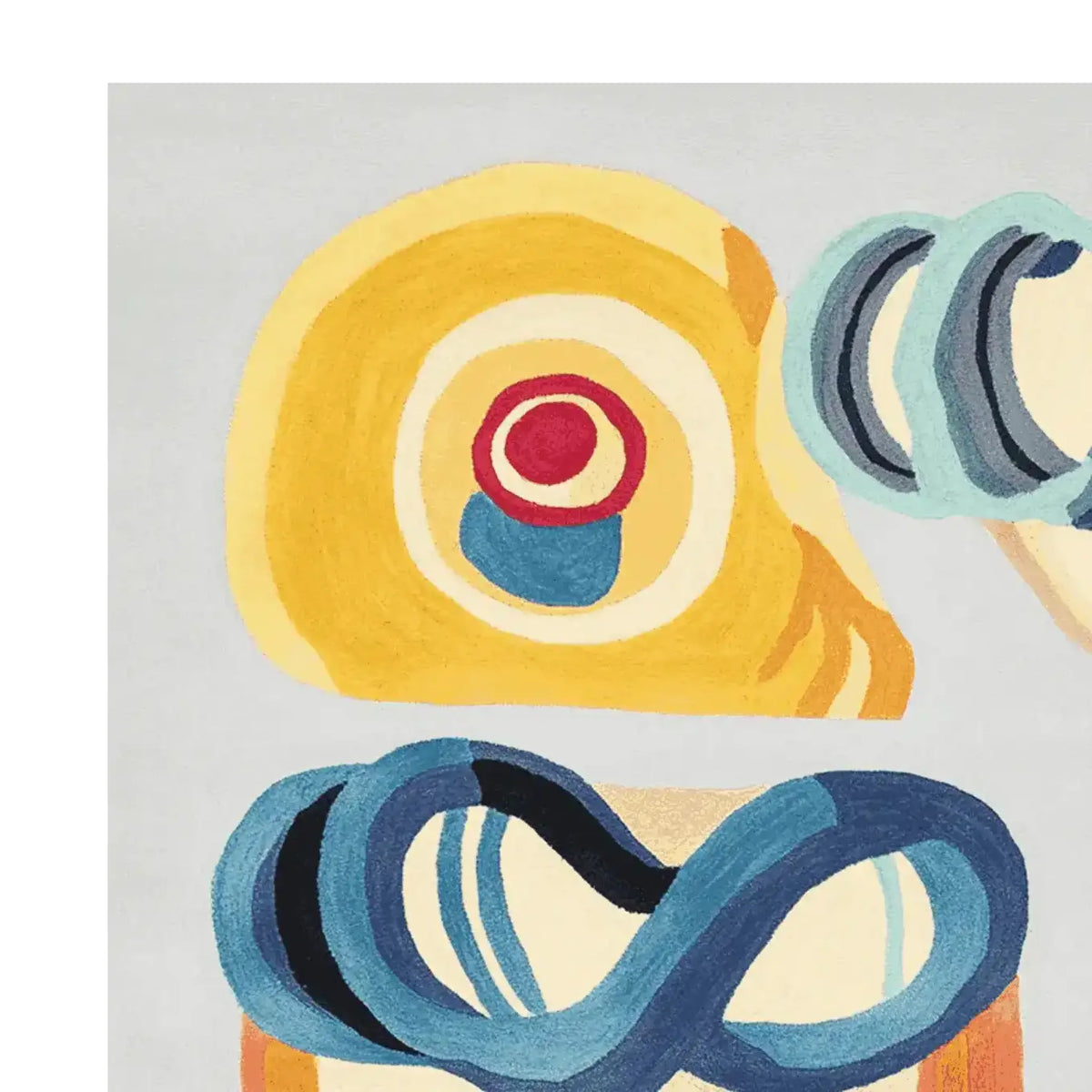 Close-up view of the Joy Shape Parade Hand Tufted Area Rug showcasing its vibrant abstract design. This contemporary wool rug features bold circles and swirls in yellow, blue, and red, making it a striking centerpiece for any living room. Ideal for those looking for unique rugs for living room decor.