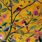 A vibrant, hand-tufted wool area rug showcasing a lively floral design with colorful birds perched on branches against a warm yellow backdrop. This eye-catching floral rug is perfect for adding a touch of nature to a living room. Ideal for large living room spaces, this wool rug combines artistry and comfort.