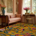 A cozy living room featuring a vibrant floral rug that adds a burst of color to the space. This hand tufted wool area rug showcases a lively pattern of flowers and leaves, perfect for enhancing large living areas with warmth and style.