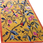 This vibrant area rug features an intricate floral design with birds on a yellow backdrop, perfect for adding a touch of nature to your living room. Made from high-quality wool, this large living room rug is both durable and decorative.