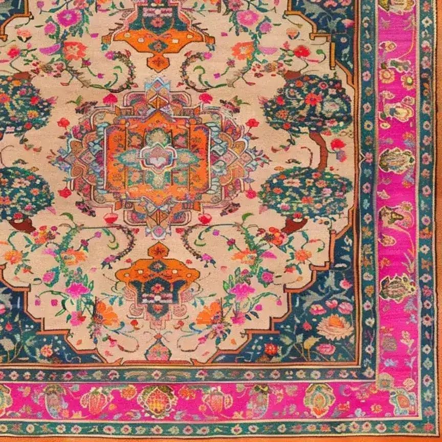 Joyful Orchard Hand Knotted Area Rug featuring a vibrant floral design with intricate patterns. The square area rug showcases a vintage Persian aesthetic, perfect for adding elegance to a dining room. This wool rug is an ideal choice for formal dining room settings, providing a splash of color with its pink and orange hues and ornate border.