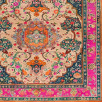Joyful Orchard Hand Knotted Area Rug featuring a vibrant floral design with intricate patterns. The square area rug showcases a vintage Persian aesthetic, perfect for adding elegance to a dining room. This wool rug is an ideal choice for formal dining room settings, providing a splash of color with its pink and orange hues and ornate border.