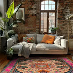 A cozy living room featuring the Joyful Orchard Hand Knotted Area Rug. This vibrant square area rug showcases a stunning floral vintage design, adding elegance and warmth to the space. The rug's intricate patterns and rich colors complement the modern decor, making it a perfect choice for dining room carpets or formal dining room rugs. Made from high-quality wool, this Persian-style rug enhances the ambiance with its luxurious texture.