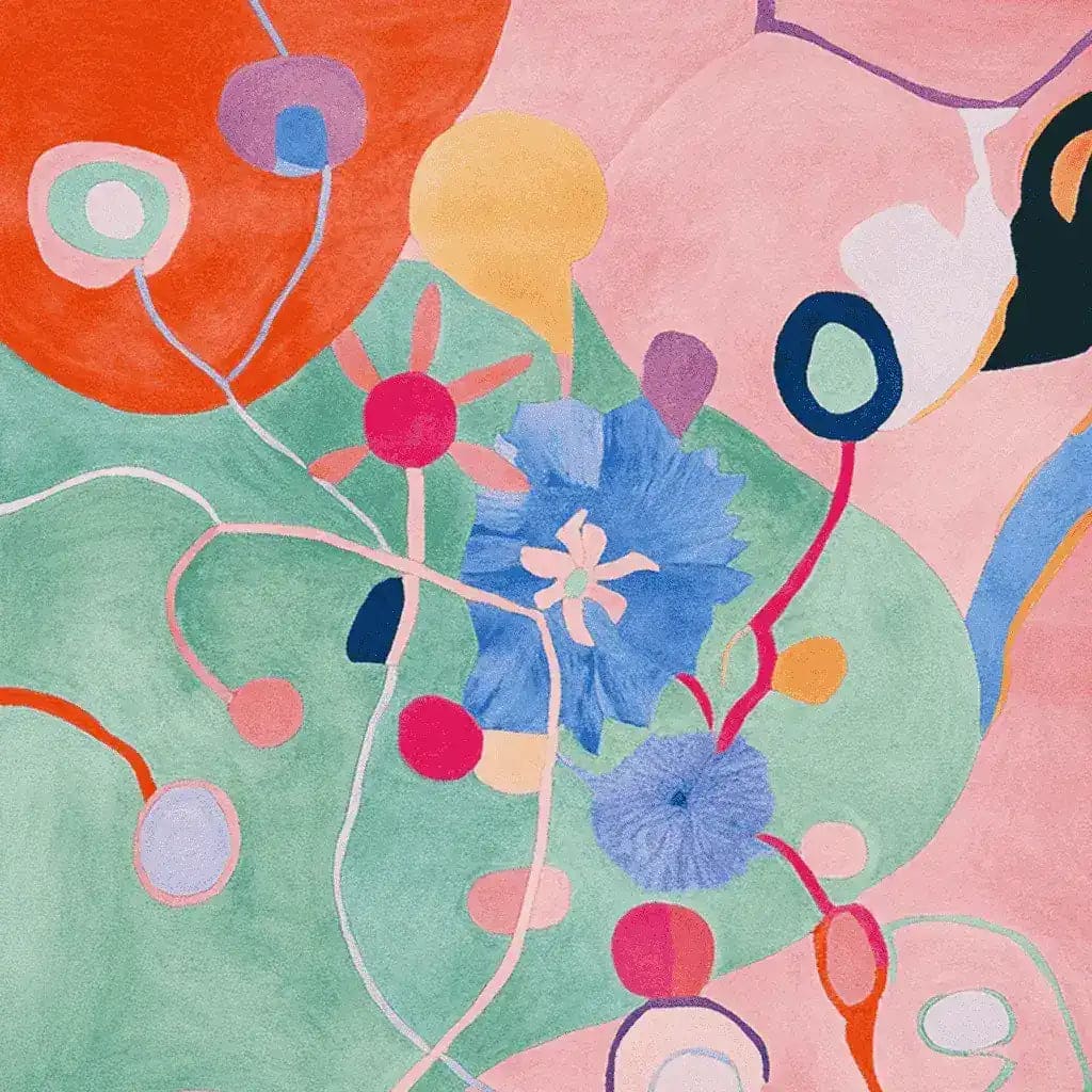 Vibrant and artistic area rug featuring abstract floral designs with bold colors like blue, pink, and orange, perfect for a contemporary living room. This wool rug adds a splash of creativity and style, ideal for those seeking large living room rugs with a modern flair.