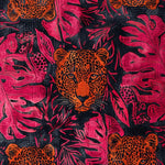 Vibrant jungle-themed area rug featuring an intricate design of orange tiger faces surrounded by bold pink foliage, perfect for adding a chic touch to bedrooms or dining rooms. This wool rug brings a touch of the wild indoors, making it an ideal choice for those looking for unique rugs for their bedroom decor.