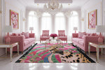 Luxurious living room with pink sofas, a colorful rug, and decorative elements.