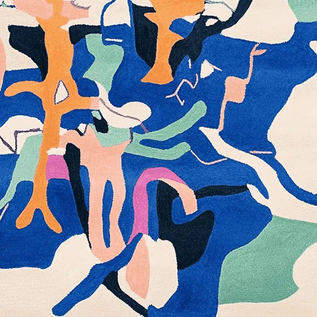 A vibrant Kaleido Field Flow hand-tufted area rug featuring an abstract design with bold blue, orange, green, and pink shapes. Perfect as a contemporary rug for living room spaces, this large wool rug adds a splash of color and modern flair to any home decor.