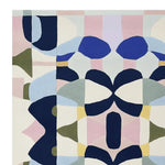 Close-up view of the Kaleidoscope Core Hand Tufted Area Rug. This contemporary wool rug features an abstract, colorful pattern with shades of blue, pink, and olive, perfect for large living rooms. Ideal as an 8x10 living room rug.