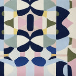 A vibrant area rug featuring a kaleidoscope of geometric patterns in blue, pink, green, and yellow. This contemporary wool rug is perfect for adding a splash of color to living rooms. Ideal as a large living room rug, it measures 8x10 and showcases an intricate design that combines modern aesthetics with comfort.