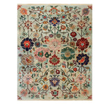 The Kaleidoscope Garden Knotted Wool Rug is a vibrant area rug featuring an intricate floral pattern with colorful blooms and vines. Ideal for large living room spaces, this floral rug adds a touch of elegance and warmth to any home decor.