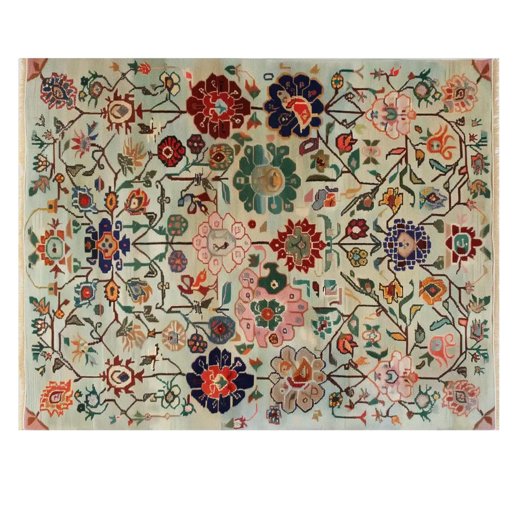 The Kaleidoscope Garden Knotted Wool Rug showcases an intricate floral pattern, ideal for adding a touch of elegance to any large living room. This area rug features vibrant colors and detailed flower motifs, perfect for those seeking a statement floral rug.