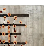 The Kibushi Harmony Hand Tufted Wool Rug showcases an elegant contemporary design, featuring abstract floral patterns on a soft, textured background. This large area rug is perfect for adding a touch of sophistication to any living room, offering a modern aesthetic while ensuring comfort underfoot.